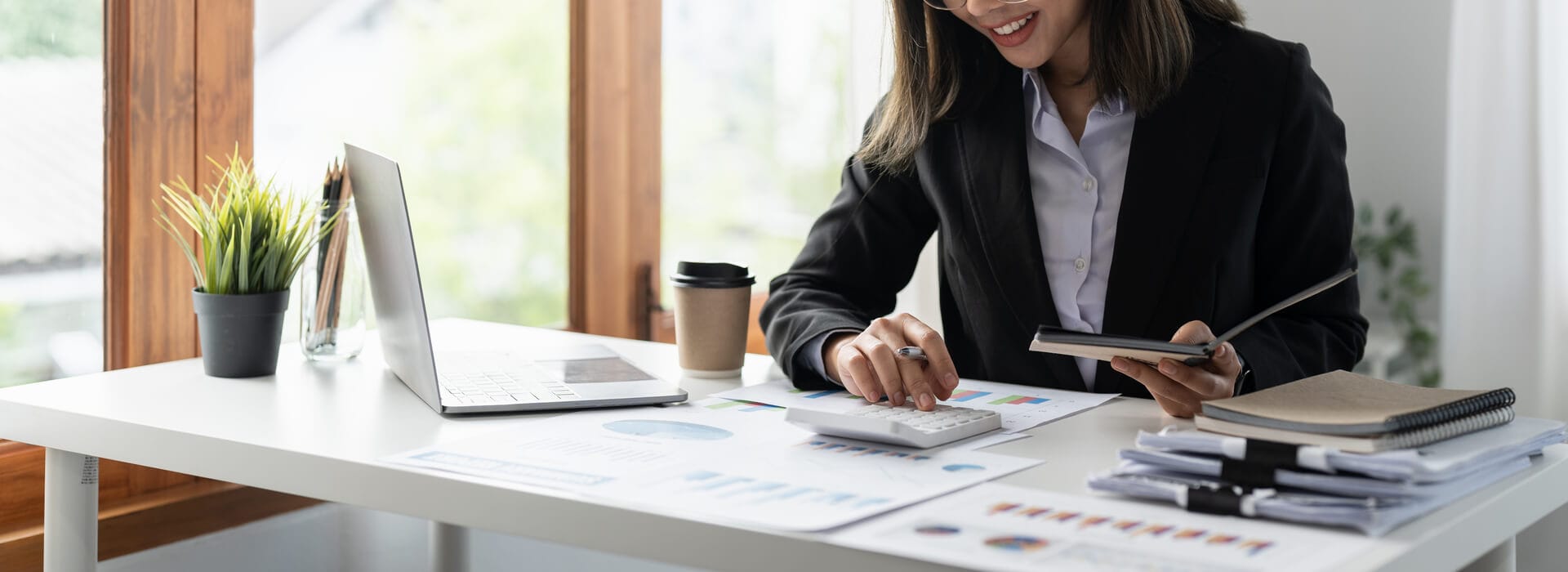 medium vecteezy businesswoman using calculator for analysis maketing plan 8569517 medium 1